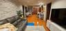 Living area featuring light wood-type flooring and recessed lighting