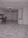 Spare room featuring light marble finish flooring