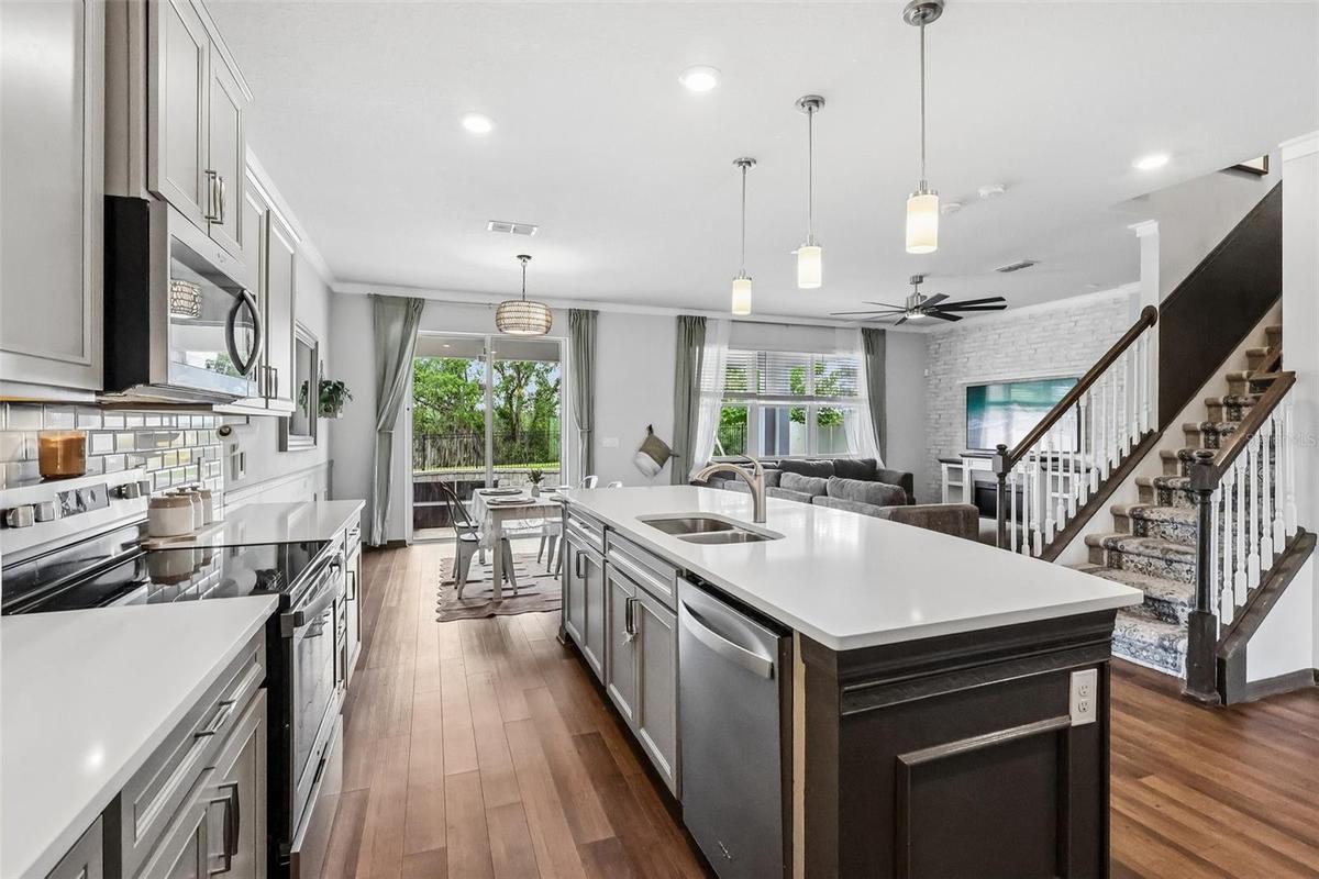 Kitchen Island with sink makes meal planning and entertaining a breeze