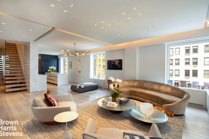 This spectacular and meticulously renovated contemporary duplex home on Central Park West has a cool, chic downtown vibe AND Central Park views.