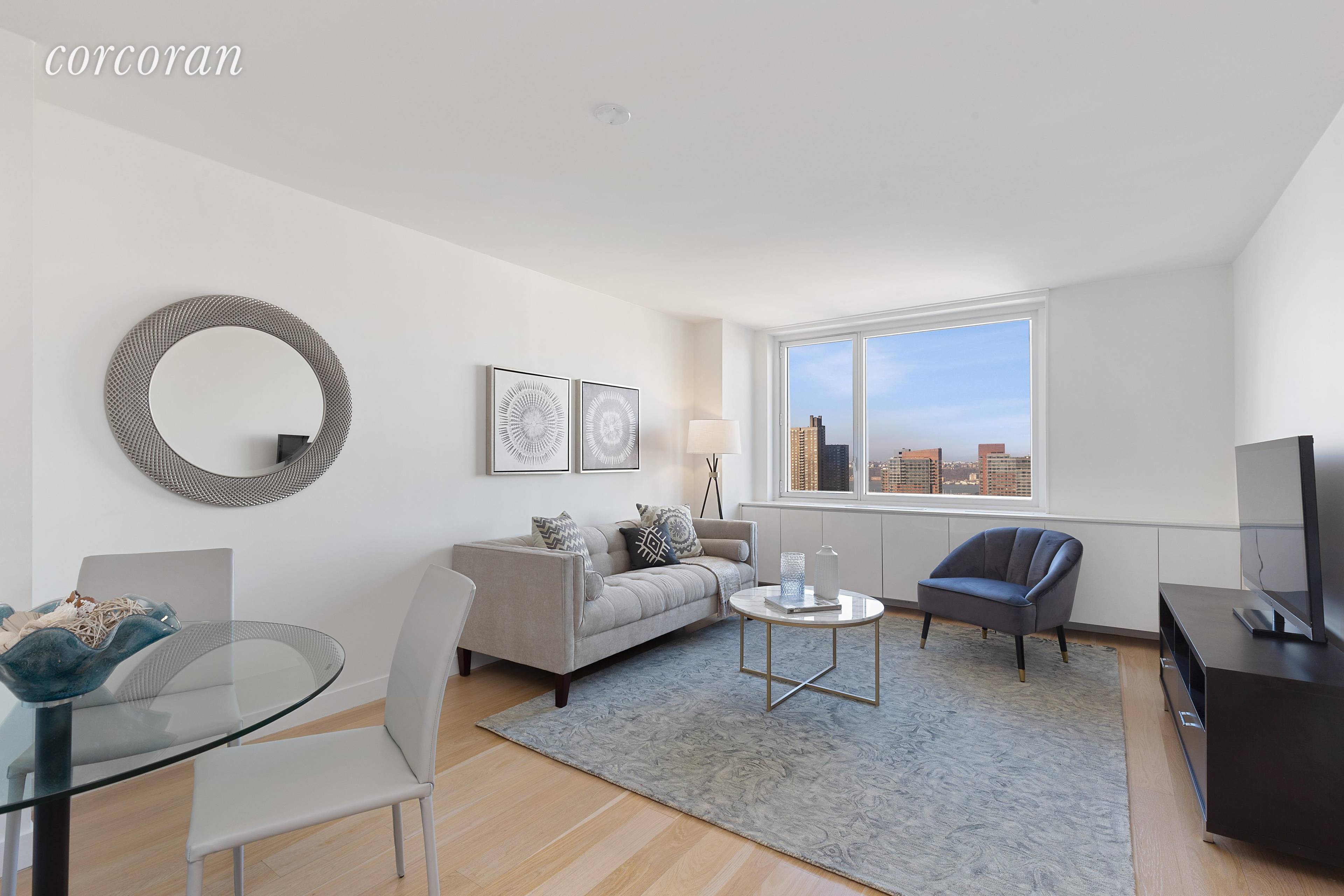 Located on the top floor of the luxurious condominium, 301 West 53rd Street, is an impeccably renovated 796 square foot two bedroom residence that faces west and has panoramic skyline ...