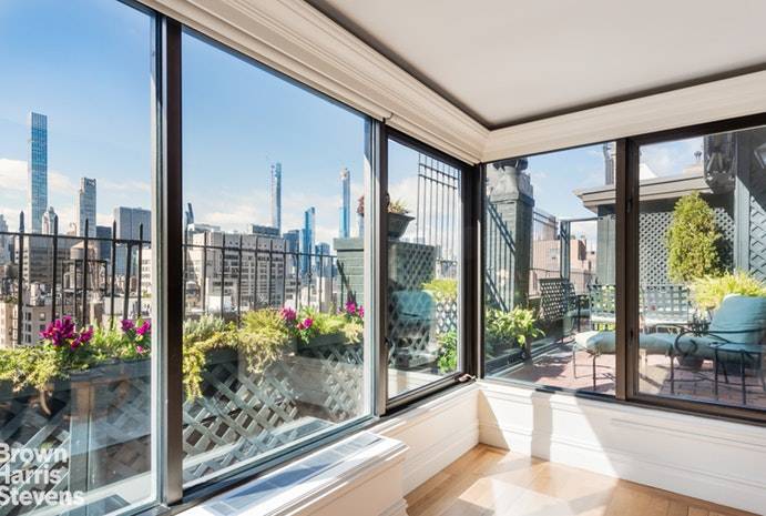This romantic and truly chic pre war penthouse is atop one of Lenox Hill's most elegant coops, 164 East 72nd Street.