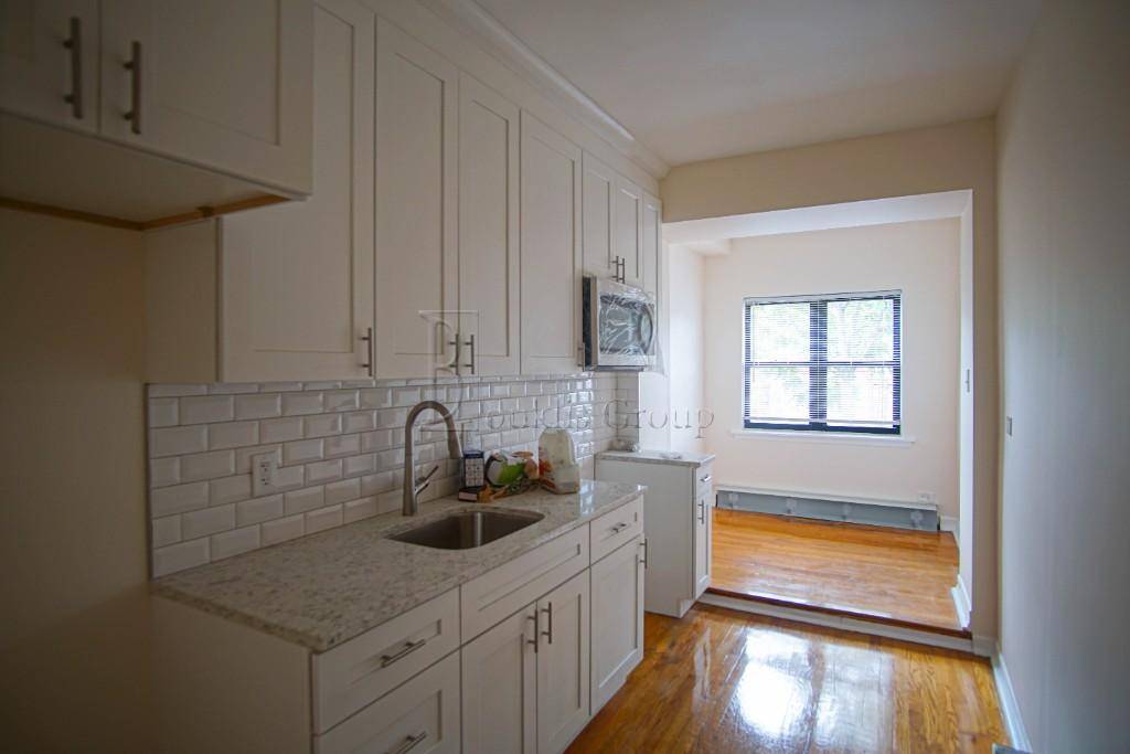Beautifully renovated duplex in a cozy tudor style house located in the heart of Riverdale !