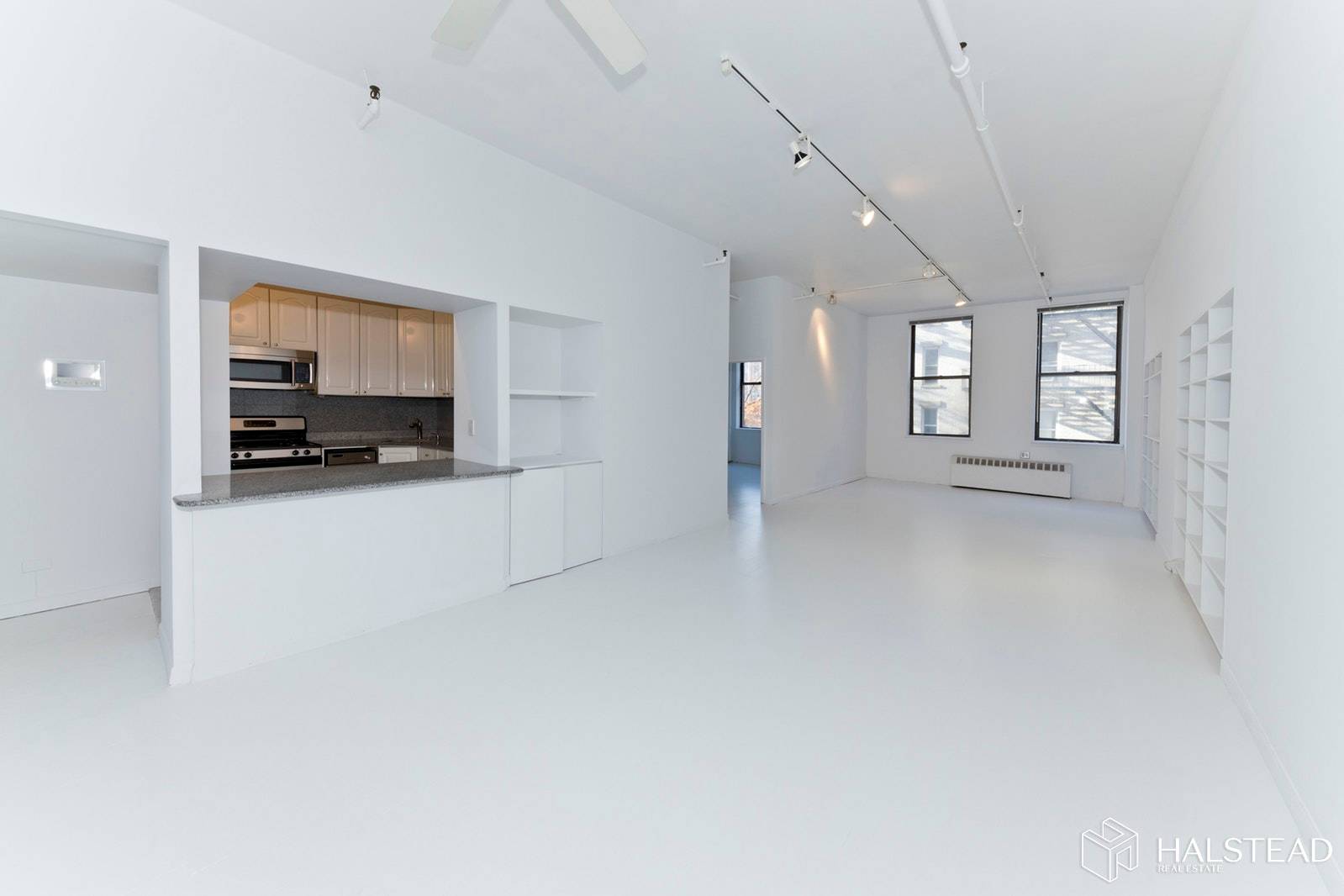 This spacious 2 bedroom, one bath loft like home has 10 foot ceilings and is located on one of Soho's most exciting blocks.