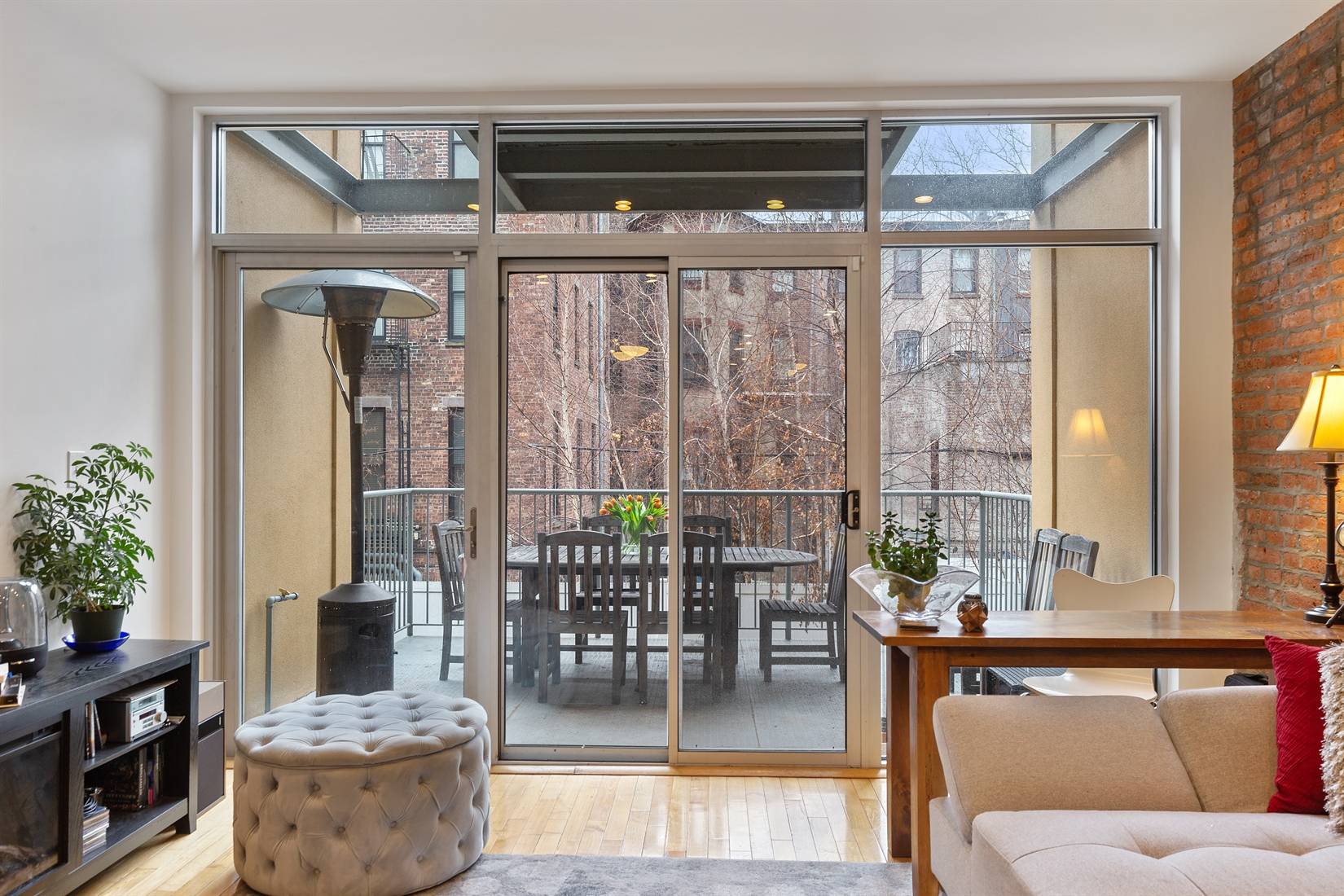 Seven outdoor spaces ! Two family townhouse with on tree lined block in Central Harlem.