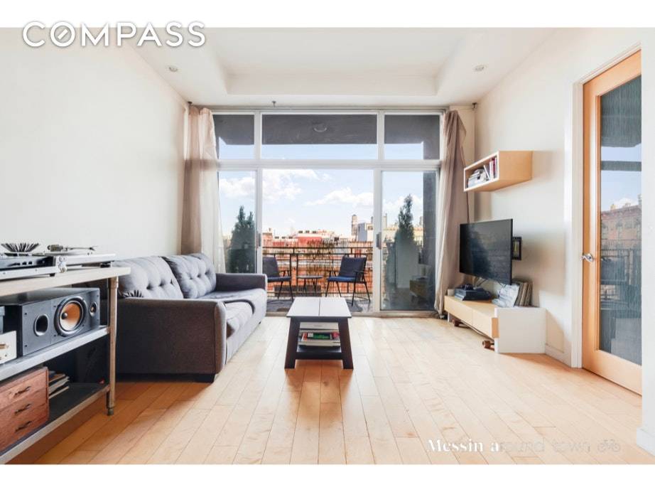 Only 2 flights up in this modern condominium, apartment 3A at 121 Kingsland Avenue offers sundrenched open views through floor to ceiling windows.