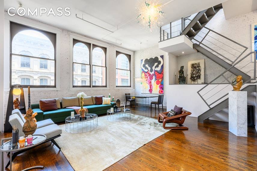 Triple mint triplex. This impeccably styled, sun flooded, downtown loft has oversized windows and a large private terrace.