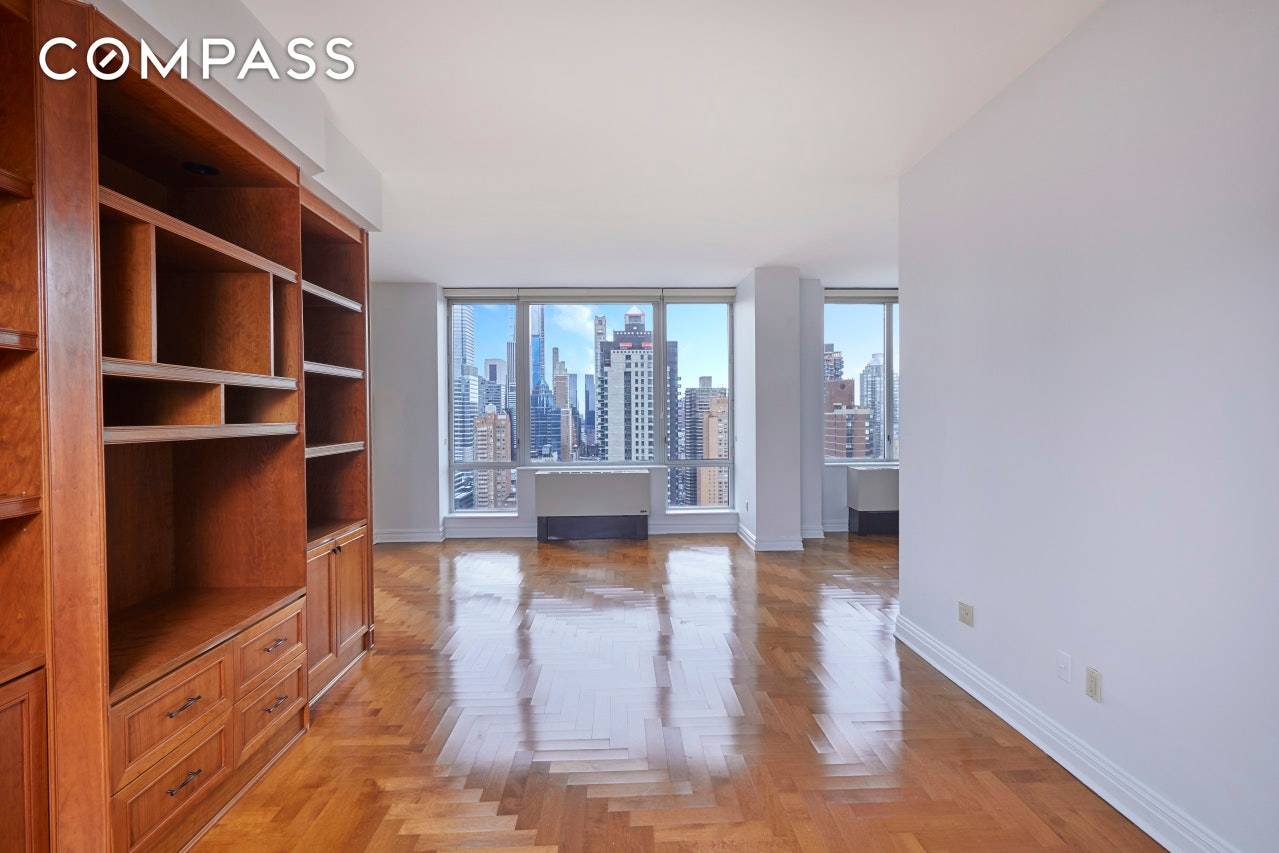 BIG PRICE REDUCTION ! East 60's Bridge Tower welcomes you to a massive 2 bedroom convertible three bedroom home.