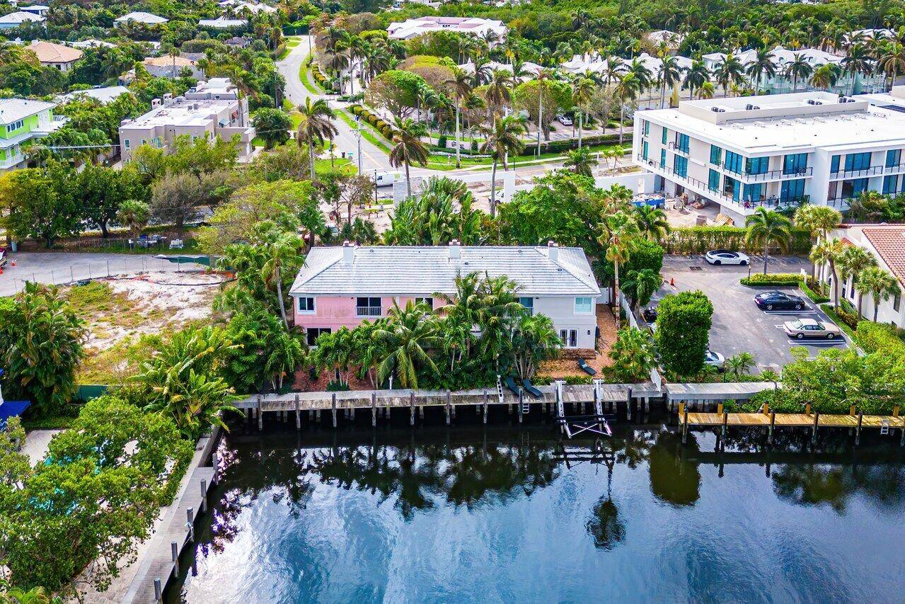 Experience coastal living at its finest in this renovated corner unit, a boater's and beachcomber's dream.