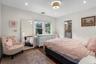 Spacious primary suite with his and hers closets.