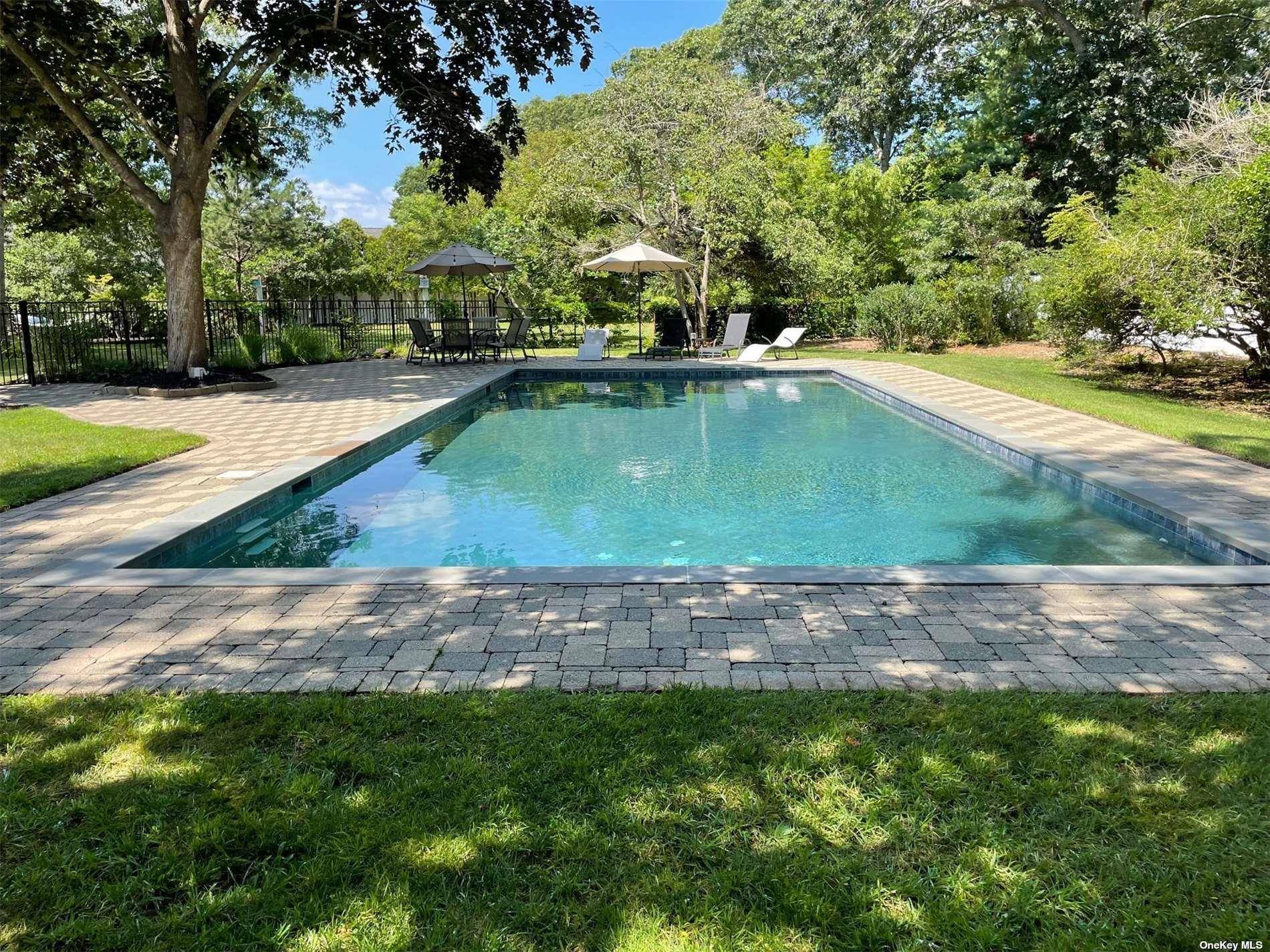Fabulous vibe in this East Quogue Summer House, expansive deck and beautiful patio and IG pool area.