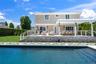 Rear view of house with a patio, an outdoor pool, a pergola, and an outdoor hangout area