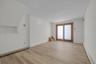 Large room with outside exit to backyard