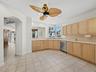 The large open kitchen has a view to the Bay through the kitchen window.