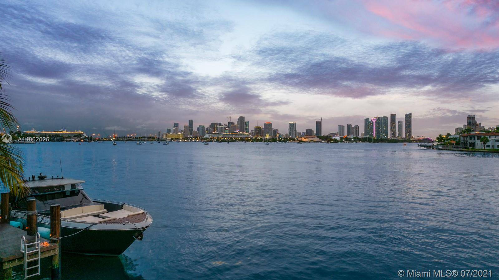 Enchanting Mediterranean estate located in the prestigious Venetian Islands, offering pristine open bay views of the Miami skyline.