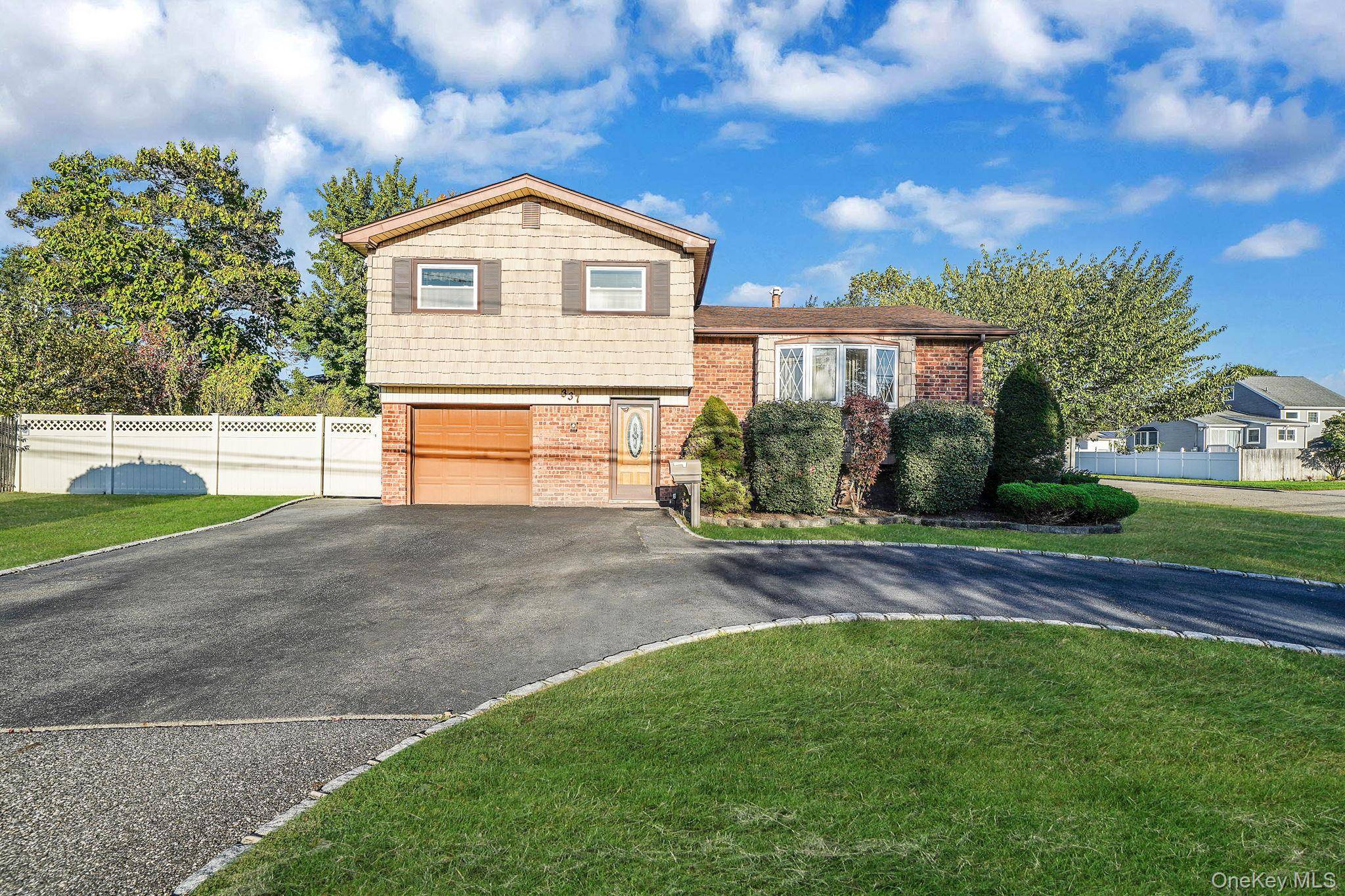 Welcome to this split level home on a desirable corner lot in the heart of Deer Park.