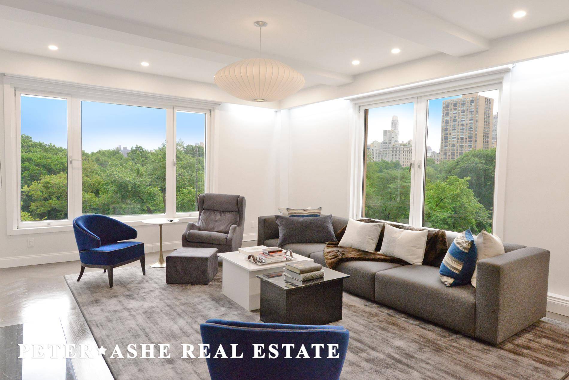 Oversized windows combine to offer postcard worthy views of Central Park from every single room in this tastefully renovated home.