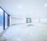 Unfurnished room featuring unfinished concrete floors