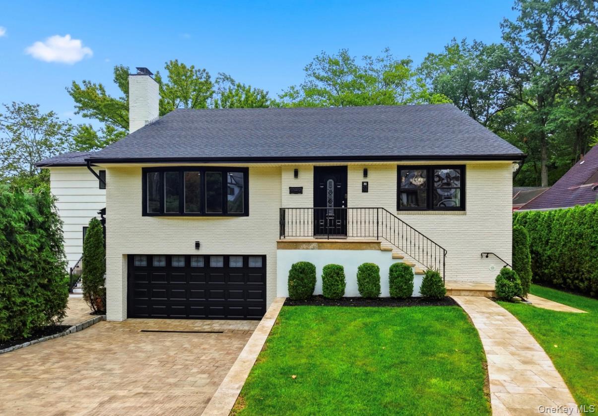 Beautifully updated exterior featuring striking black-and white finishes.