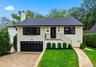 Beautifully updated exterior featuring striking black-and white finishes.