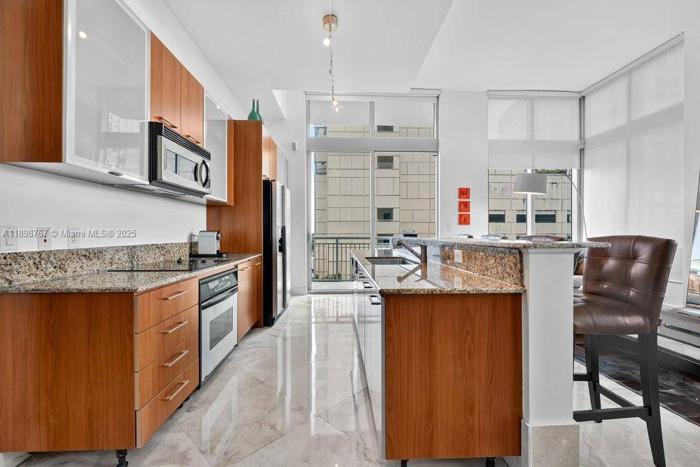 Modern Loft Style Corner Residence This one of a kind home features 13 ft ceilings, two spacious balconies, and floor to ceiling windows that fill every room with natural light.