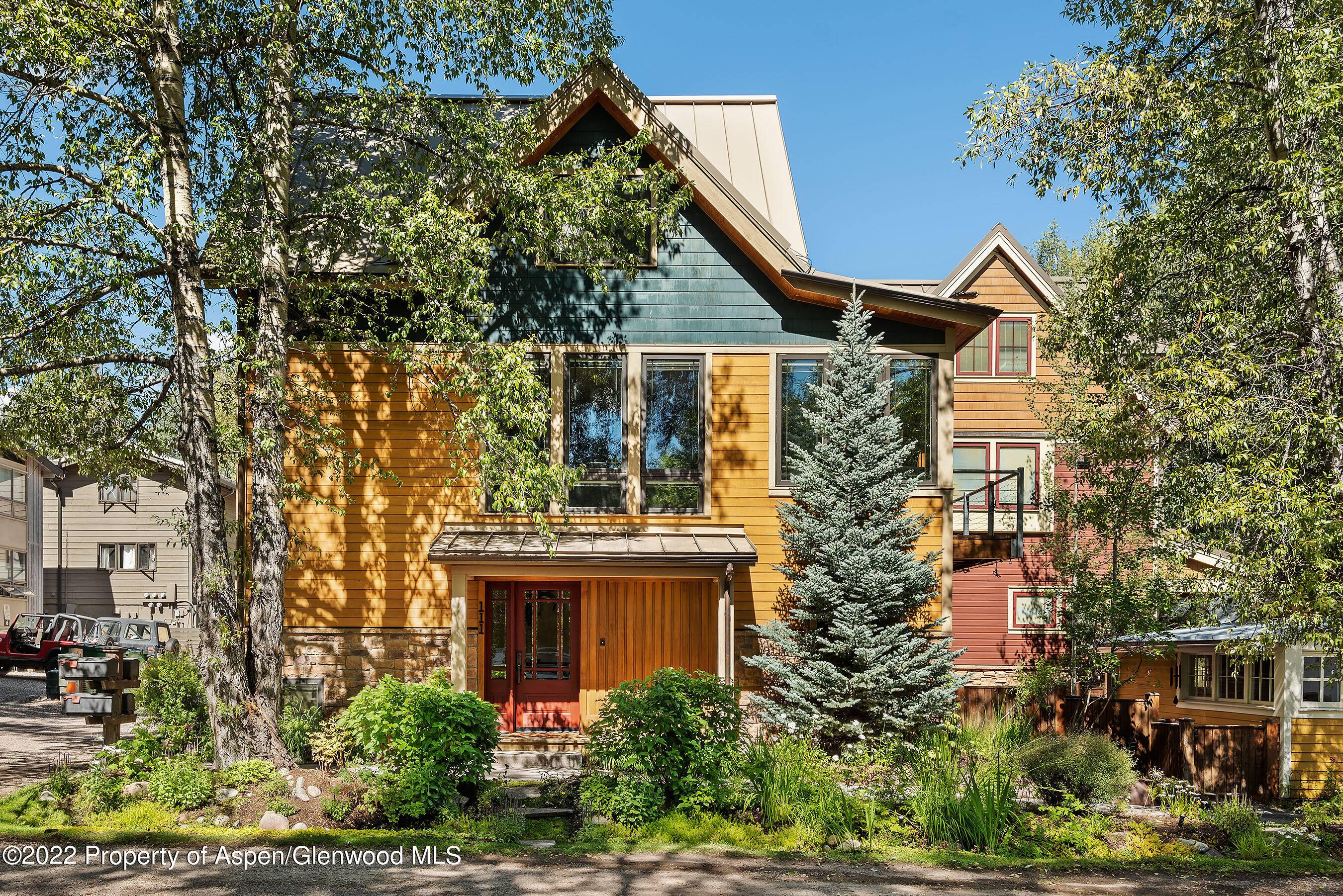 Charming three bedroom single family home in the West End with some of the most gorgeous flowers in Aspen.