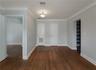 Large room/office/conference room with record room/library.