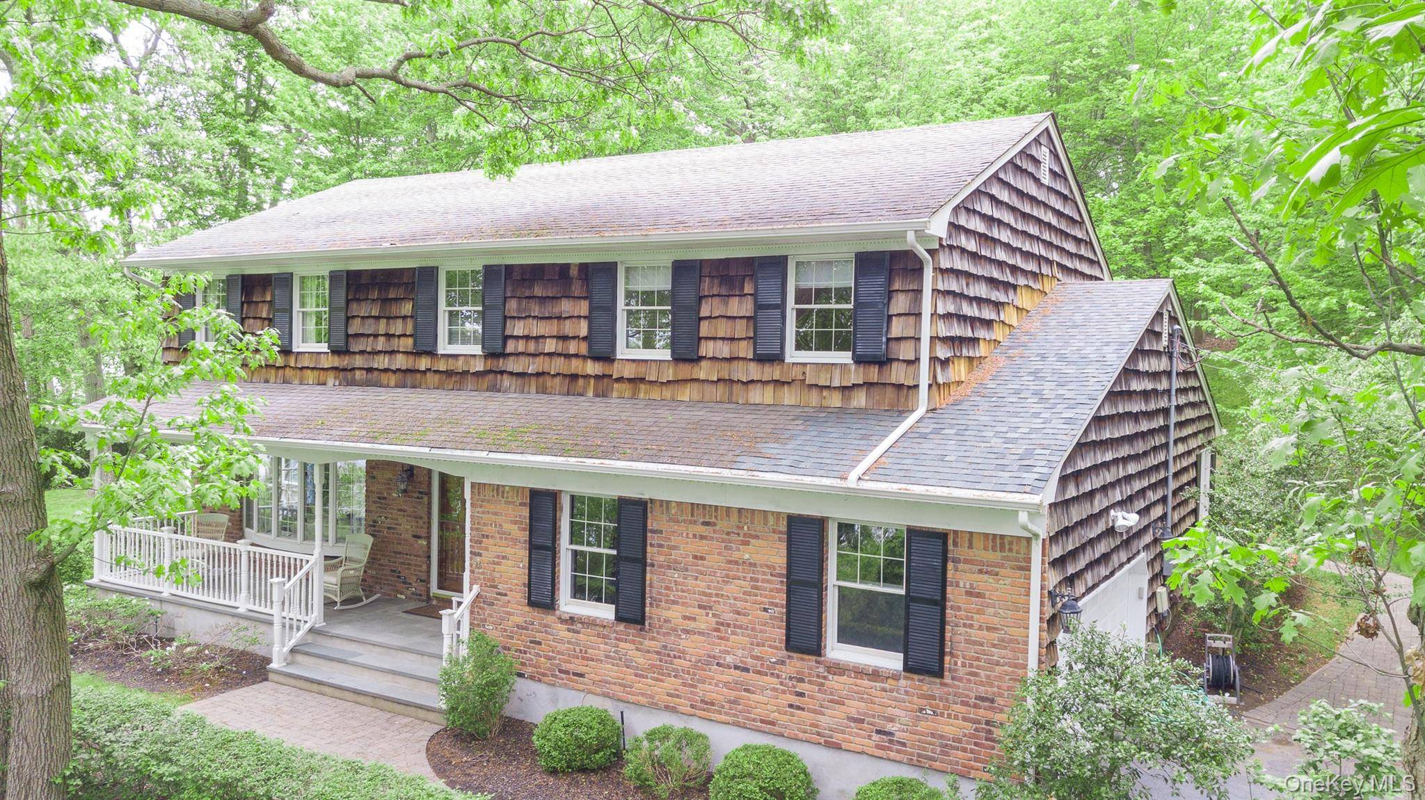 Recently Remodeled Colonial Home on 2 Acres of Property Overlooking the Nissequogue River with Rocking Chair Front Porch.