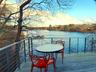 Dock area with a water view and a balcony