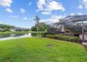 Backyard pond views create a peaceful private setting.