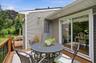 Spacious outdoor deck featuring natural wood decking and railings