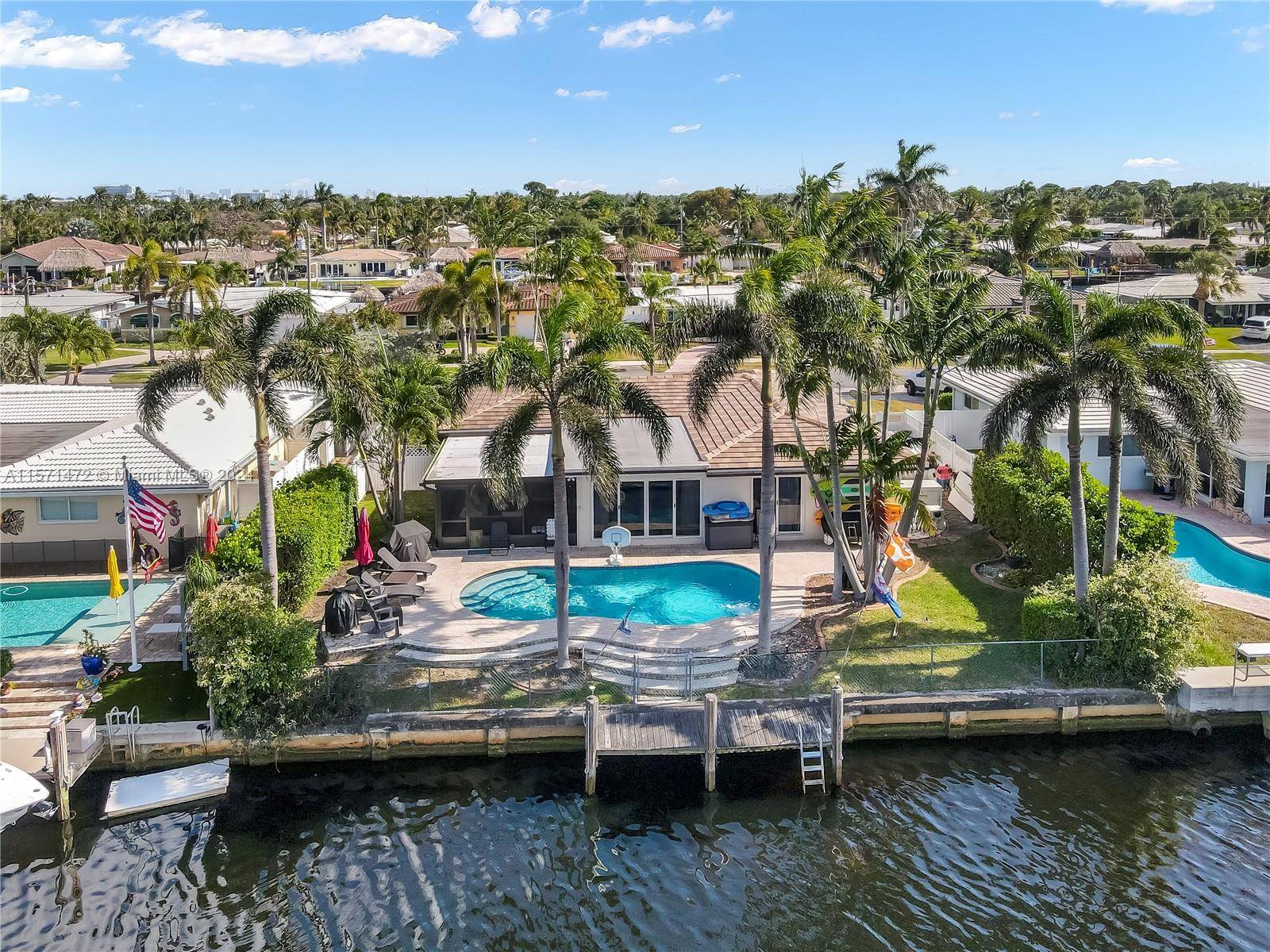 Beautiful waterfront home in a great neighborhood on a rare wide canal with amazing views.