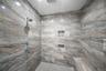 Full bathroom with a tile shower