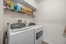 The laundry has storage and yes the washer and dryer stay.
