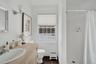 Full bathroom featuring a stall shower and vanity