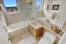 Bathroom with a wealth of natural light, toilet, and vanity