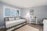 Bedroom featuring baseboards and wood finished floors
