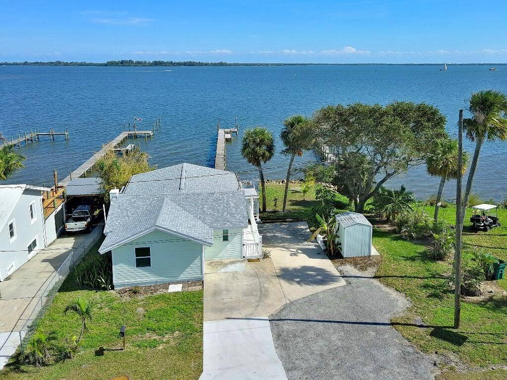 Discover a charming riverfront oasis with a 150' private dock on the Indian River.