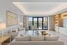 Spacious open concept living room with tongue and groove ceiling details and lighting