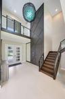 Beautiful custom wood designed stairway w custom glass panels