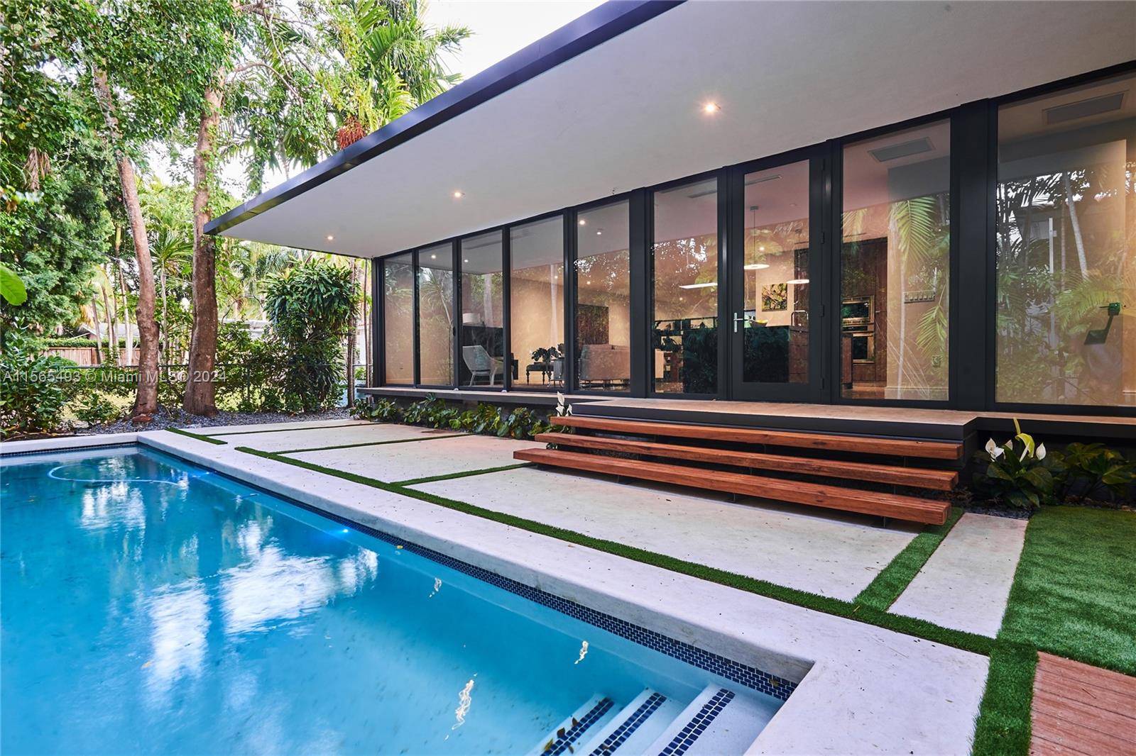 DESIGNED BY FAMED ARCHITECT JACOB BRILLHART THIS MODERN TROPICAL RESIDENCE SITUATED THE HEART OF COCONUT GROVE SPANS OVER 3500 SQ FEET AND IS PROUDLY L.