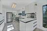 Overview of kitchen with stainless steel appliances