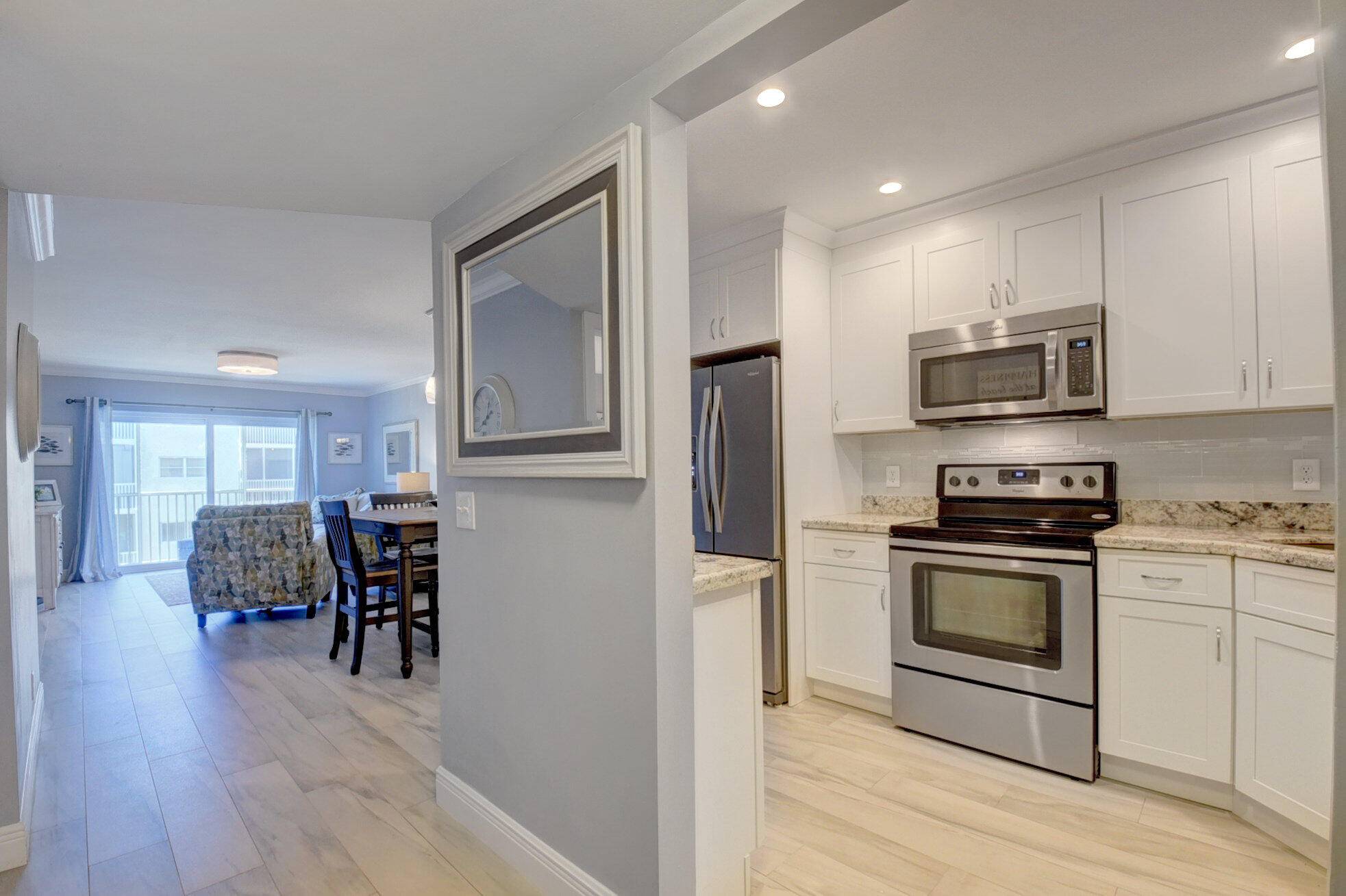 Available for rent ! Completely updated, open style kitchen and SS appliances, granite countertops, all impact windows, remodeled baths, wood look porcelain tiles throughout, smooth ceilings with crown moldings.