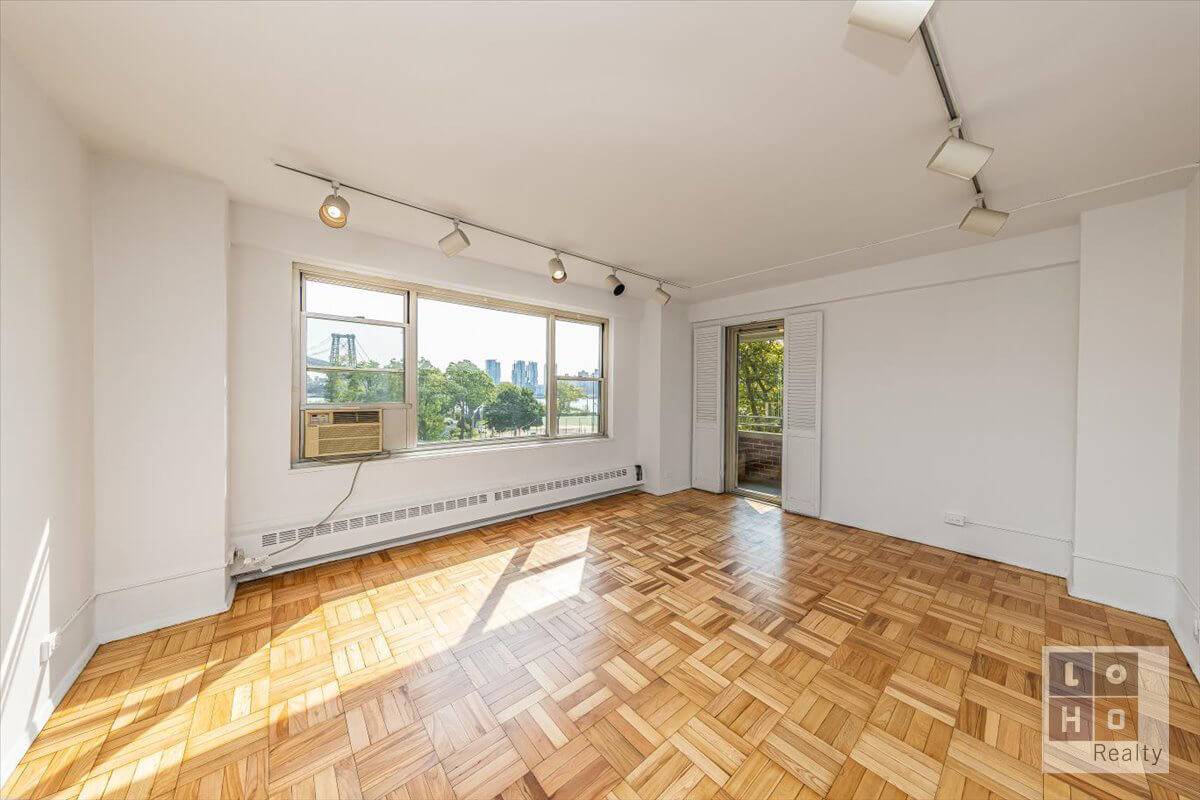 Large, 2 bedroom balcony apartment offering fantastic tree lined views of the East River amp ; Williamsburg Bridge !