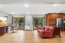 Den with Wall Air Conditioner & 2 French Doors to Backyard Deck