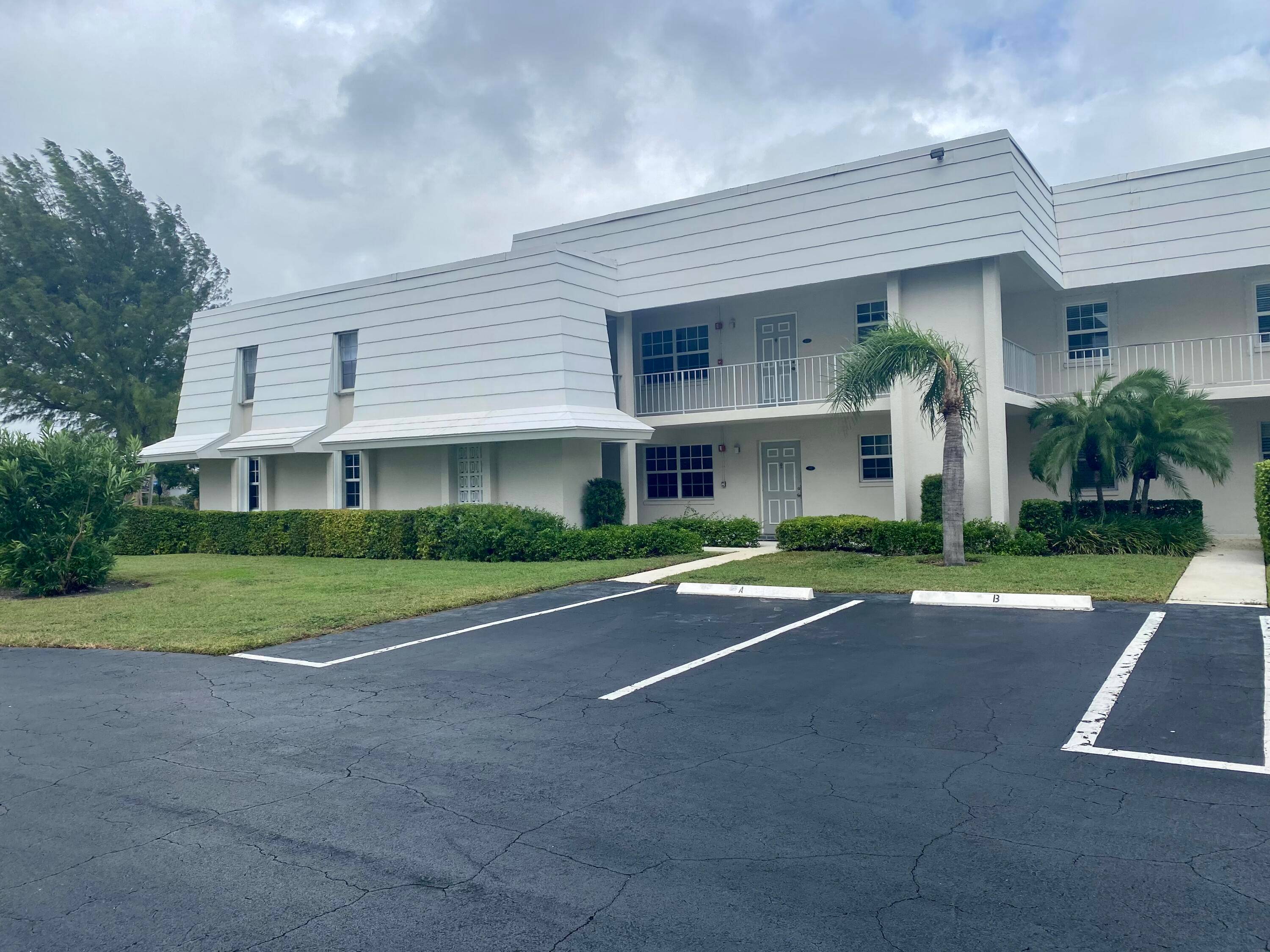Your vacation home awaits in this fully renovated and furnished 2 bedroom, 2 bath corner unit on the first floor, boasting a spacious den for added versatility.