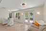 Versatile Florida room filled with natural light, offering the perfect space for a dining area, sitting room, home office, or additional living space.