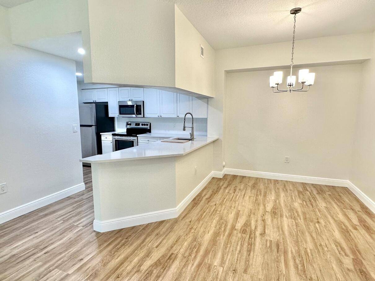 This beautifully renovated 1 bed and 1 bath condo located in the heart of PBG just 5 minutes from the beach.