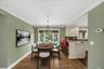 Cozy dining area overlooking expansive backyard. Dining set has been virtually staged.