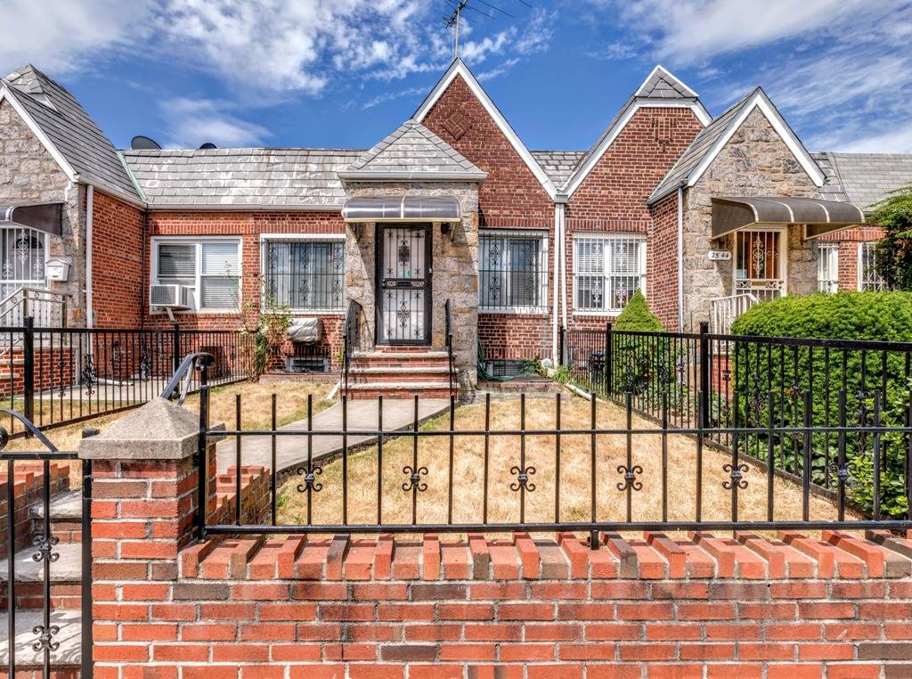 Beautiful and bright single family prewar brick row house built in 1935 featuring two bedrooms, two full bathrooms, a spacious arched ceiling living room, bright dining area, and a renovated ...